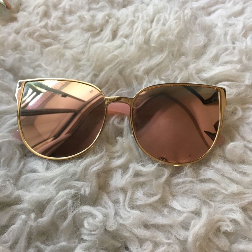 Pink and gold glasses with mirrored lenses